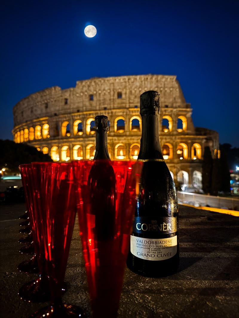 Golden hour toast in front of the Colosseum
